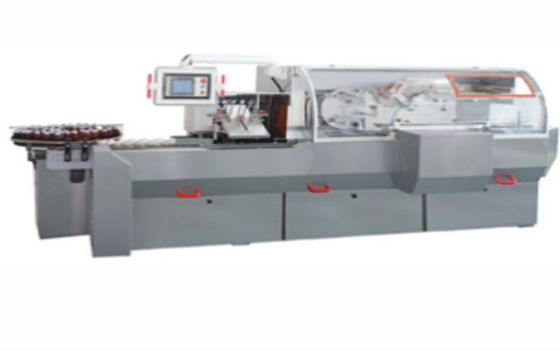 AUTOMATIC CARTONING MACHINE